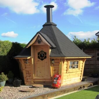 Backyard Exclusive BBQ Hut 7.0 m² with Big K charcoal and clear blue sky